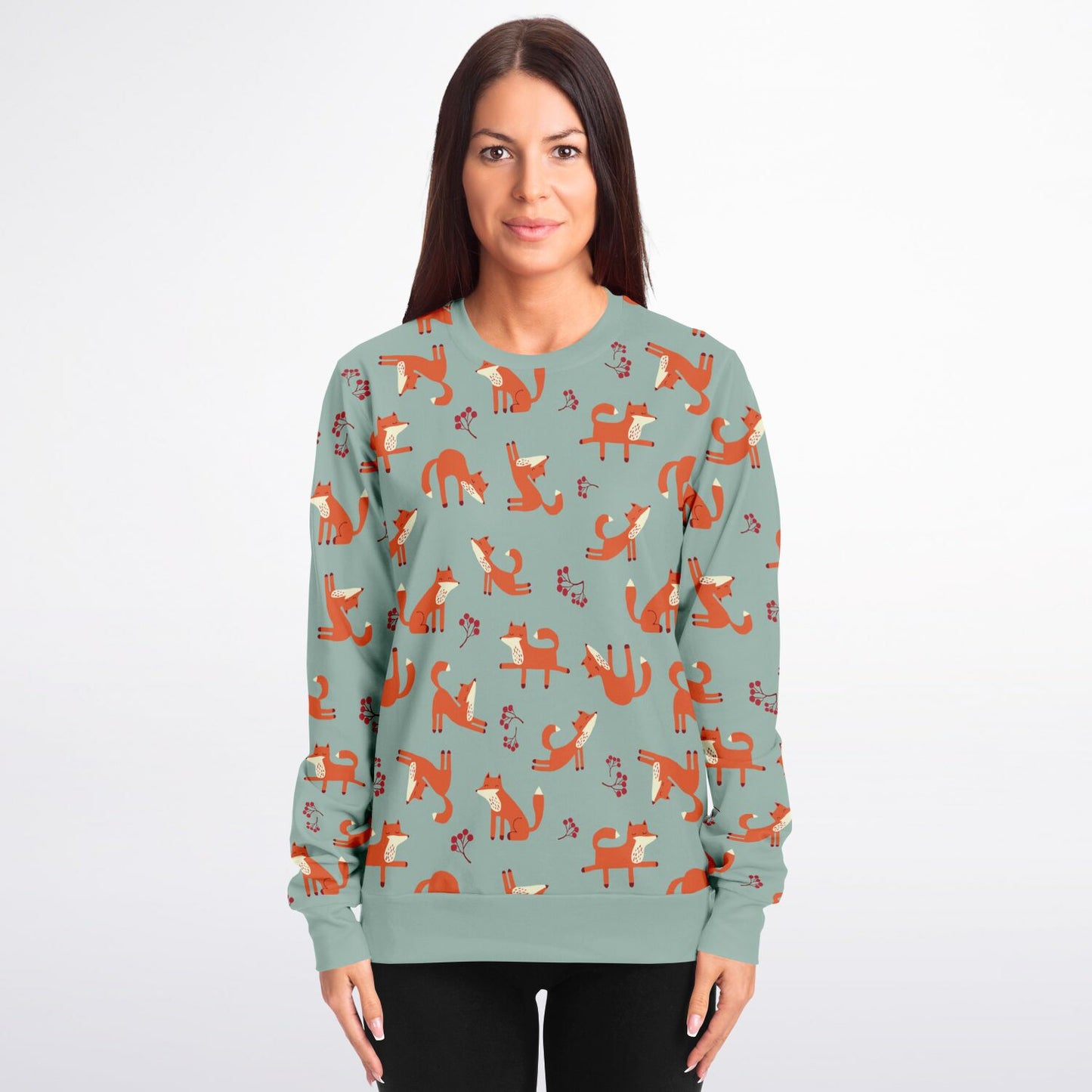 A woman wearing a lichen green unisex sweatshirt with Playful Fox -pattern.