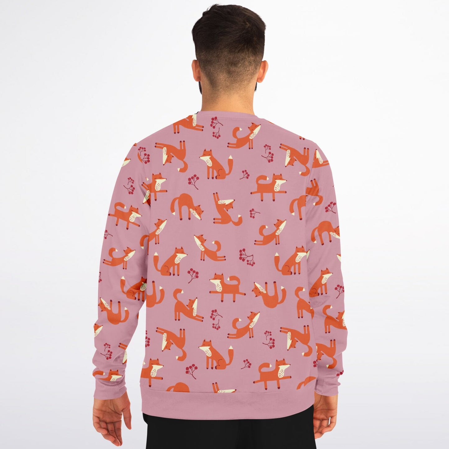 A man wearing a pink unisex sweatshirt with Playful Fox -pattern, back view.