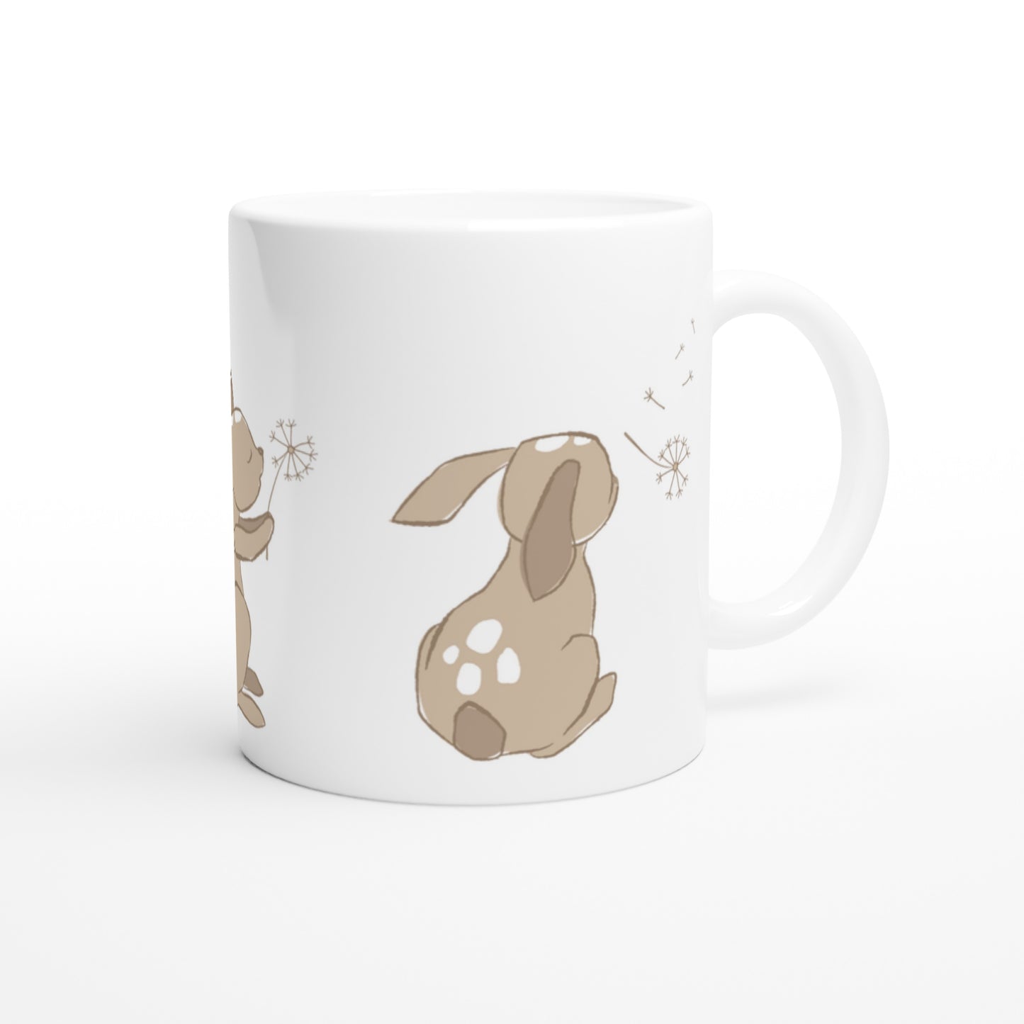 White ceramic mug with a sand brown Dandelion and hare print.