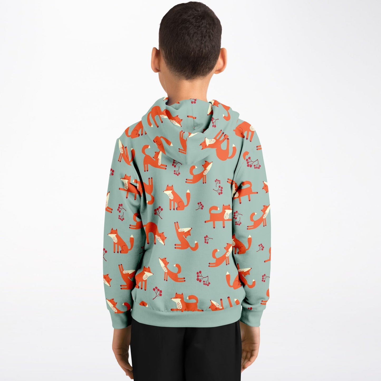 A boy wearing a lichen green hoodie with playful fox pattern.