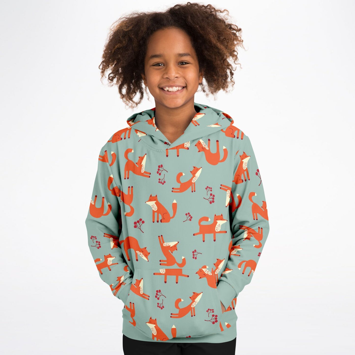 A girl wearing a lichen green hoodie with playful fox pattern.