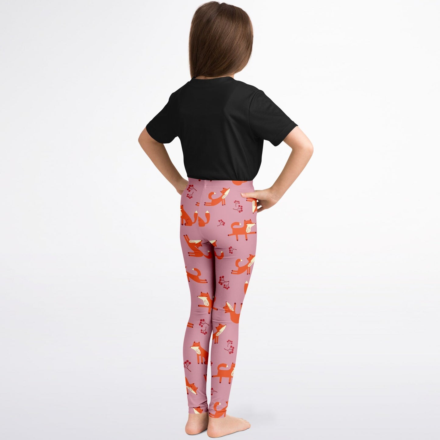 A back view of a girl wearing pink leggings with Playful Fox pattern.