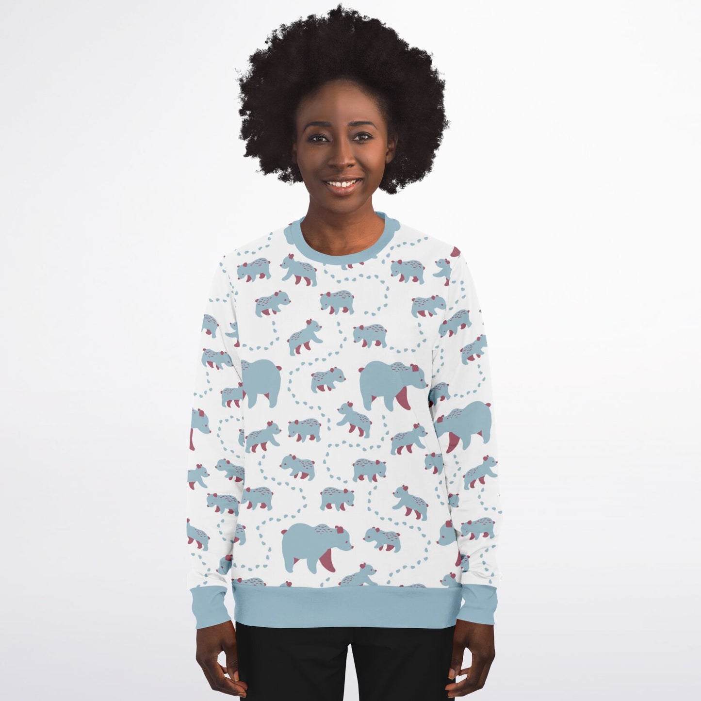 A woman wearing a unisex sweatshirt with blue Runaway Cubs -pattern.