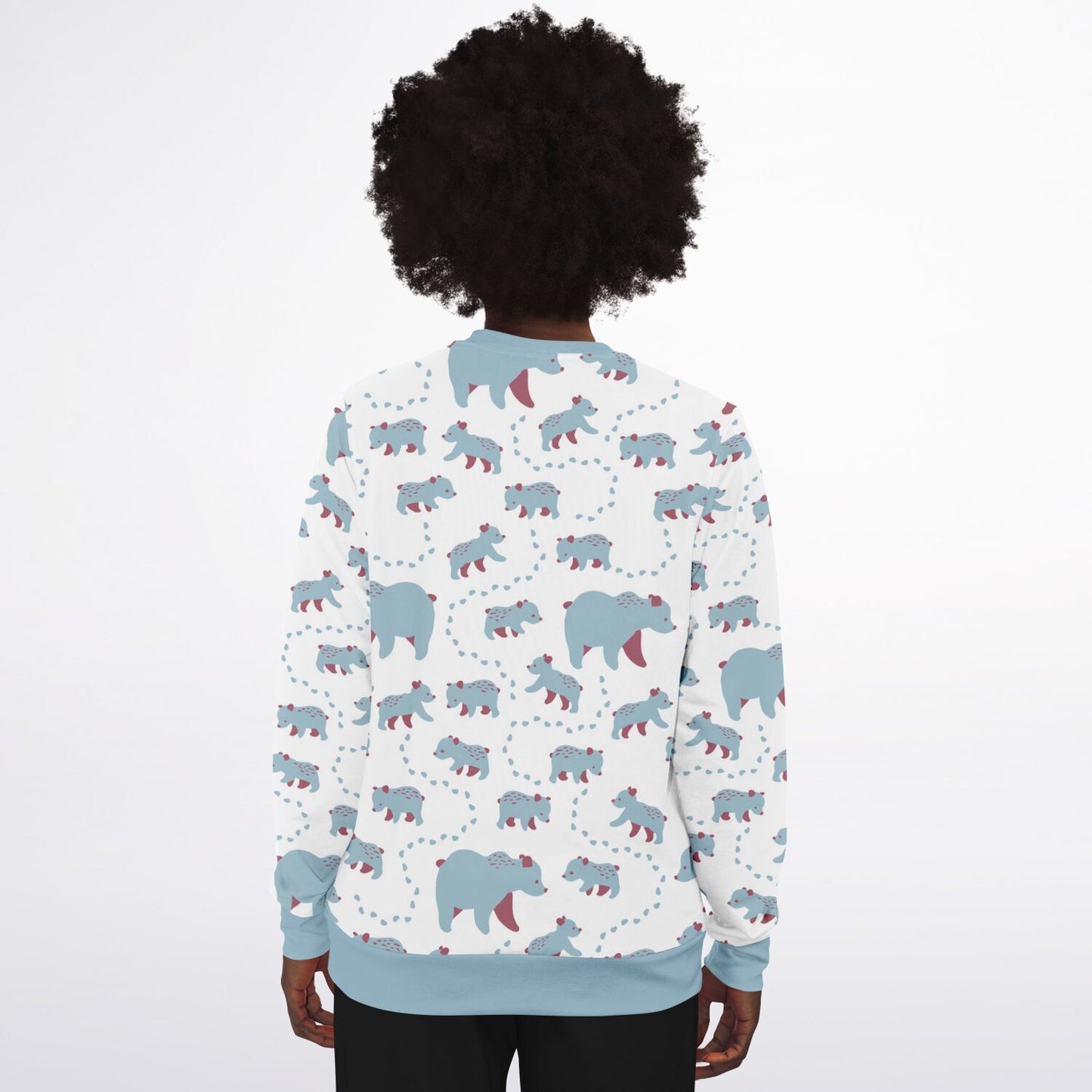 A woman wearing a unisex sweatshirt with blue Runaway Cubs -pattern.