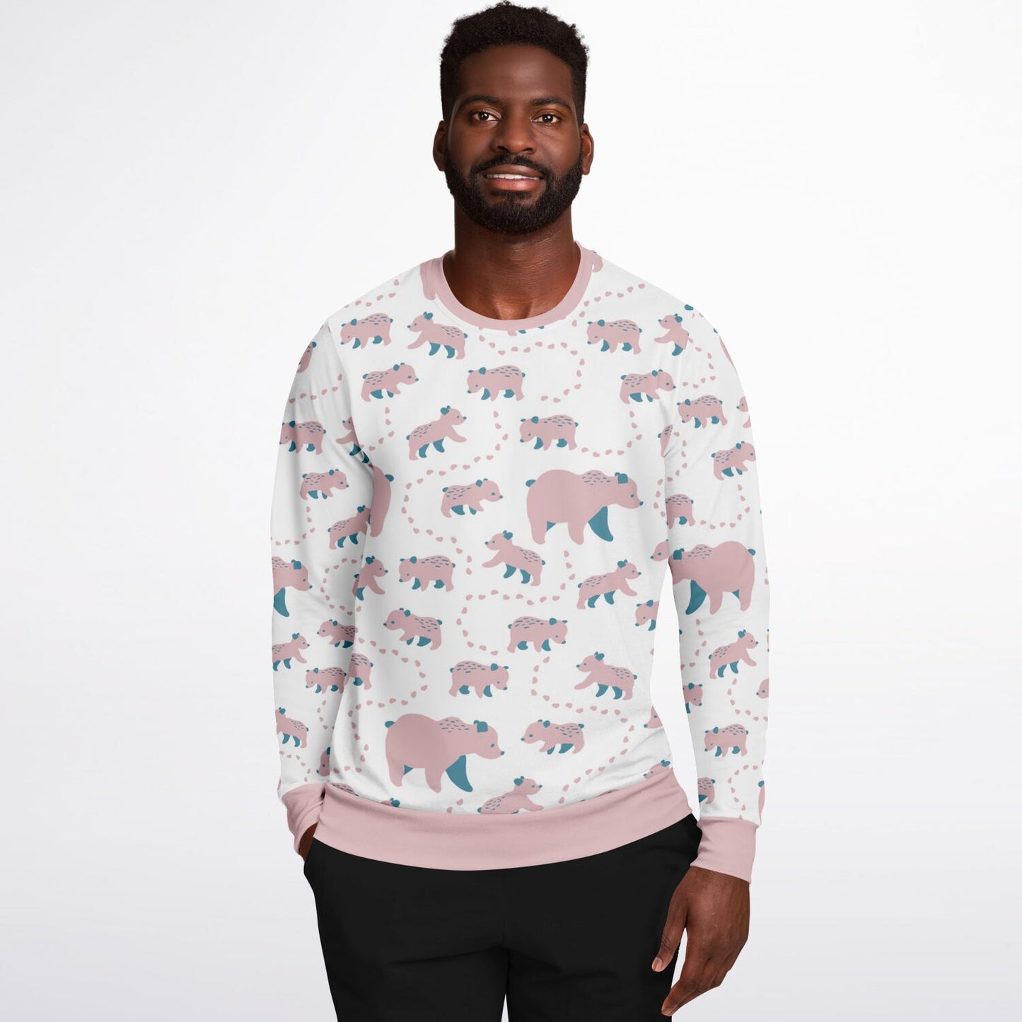 A man wearing a unisex sweatshirt with pink Runaway Cubs -pattern.