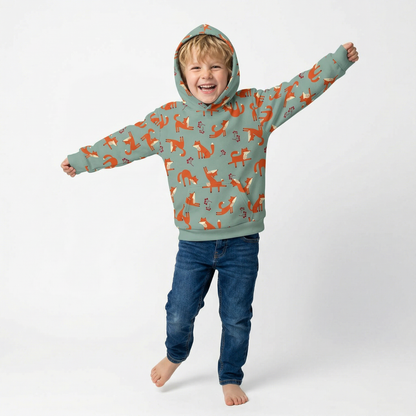 A boy wearing Playful Fox -print hoodie