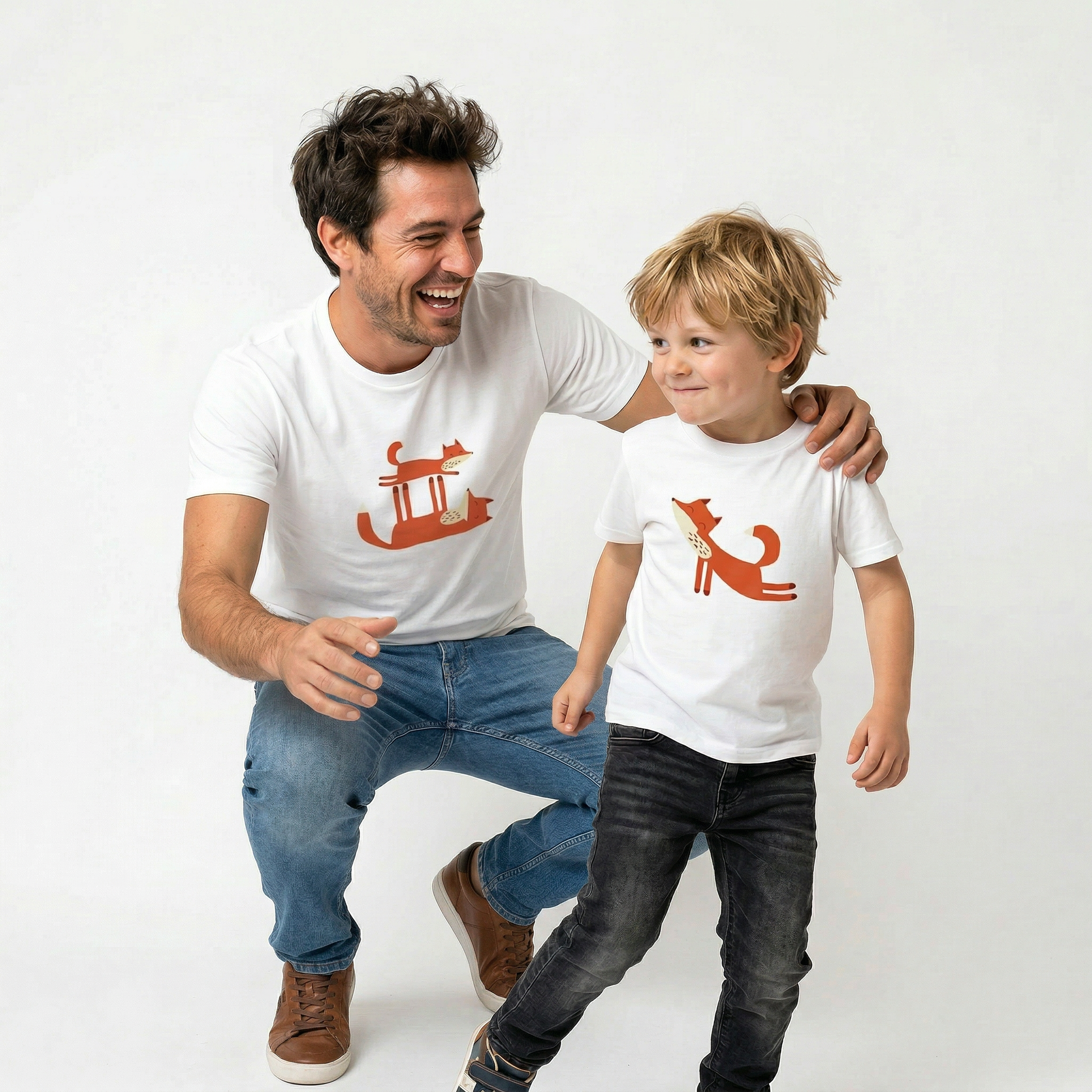 Father and son wearing matching Playful Fox -print T-shirts