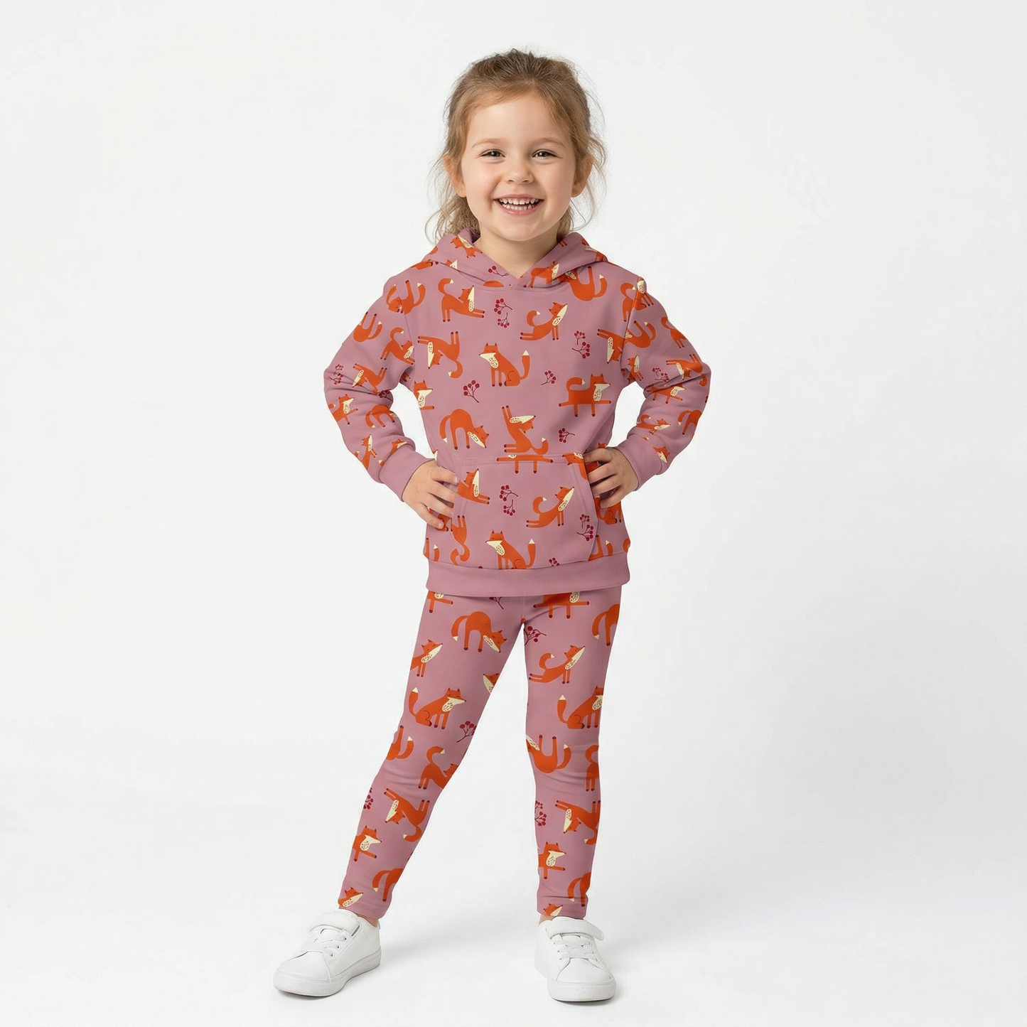 A girl wearing pink Playful Fox -print hoodie and leggings