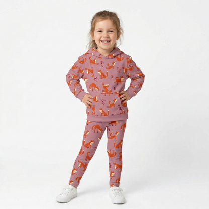 A girl wearing pink Playful Fox -print hoodie and leggings