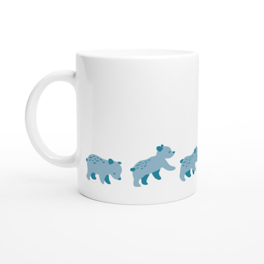 White ceramic mug with a blue bear family print.