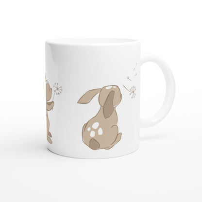 White ceramic mug with a sand brown Dandelion and hare print.