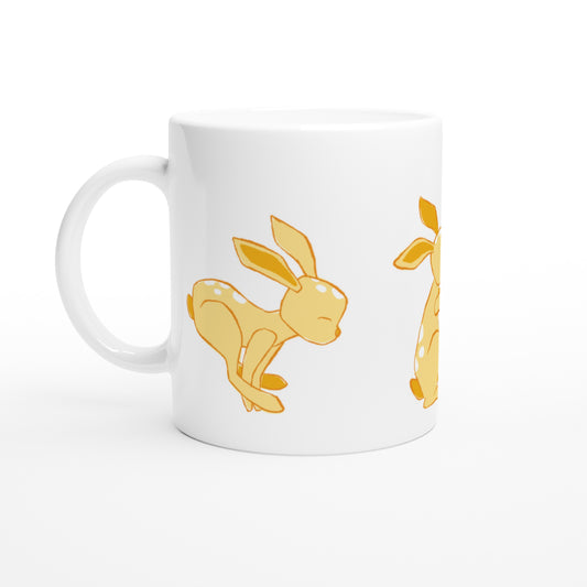 White ceramic mug with a yellow Dandelion and hare print.