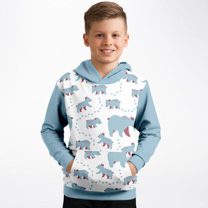 A boy wearing a hoodie with Runaway Cubs pattern.