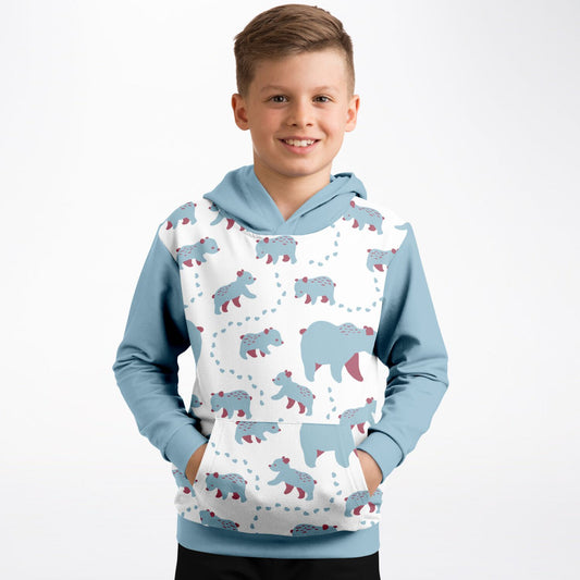 A boy wearing a hoodie with Runaway Cubs pattern.