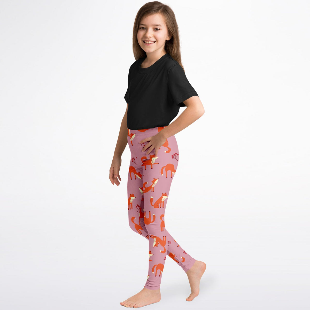 A side view of a girl wearing pink fox print leggings