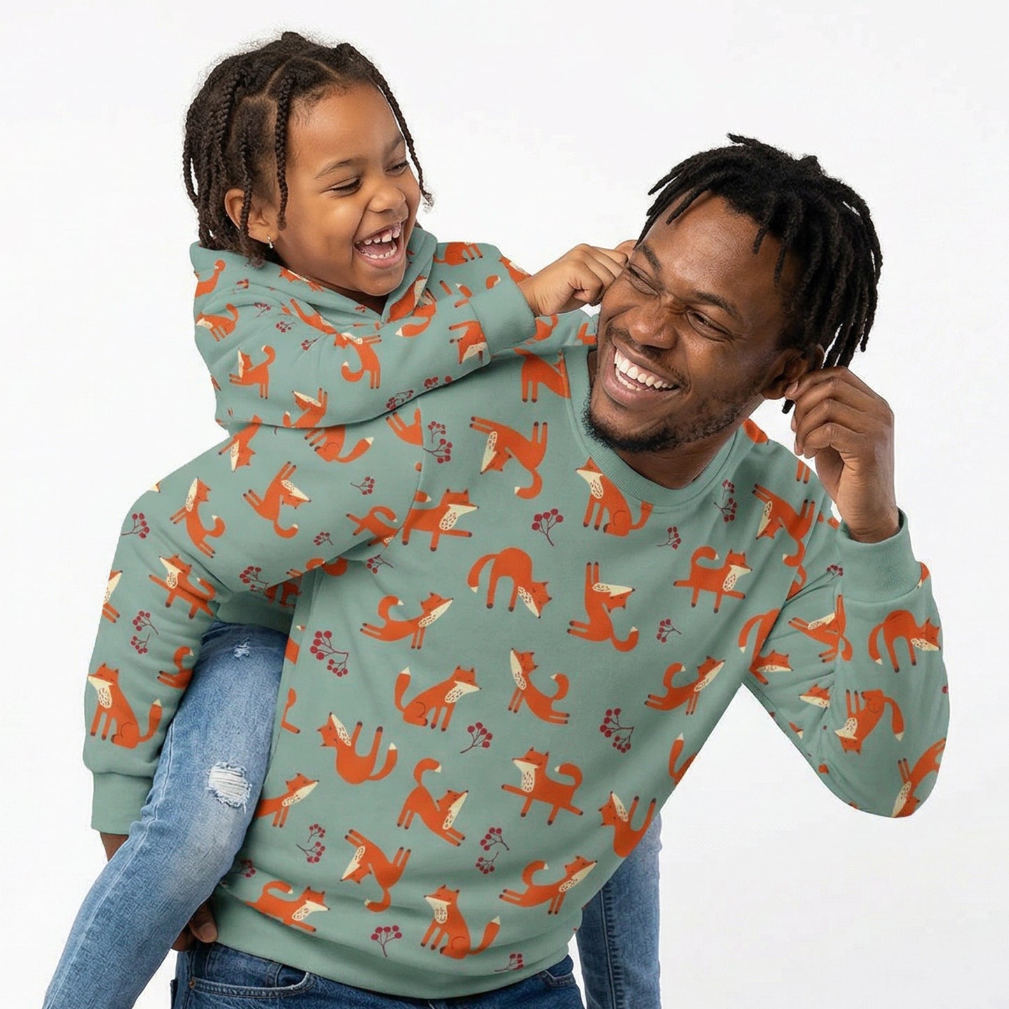 Father and daughter wearing matching Playful Fox -print clothing