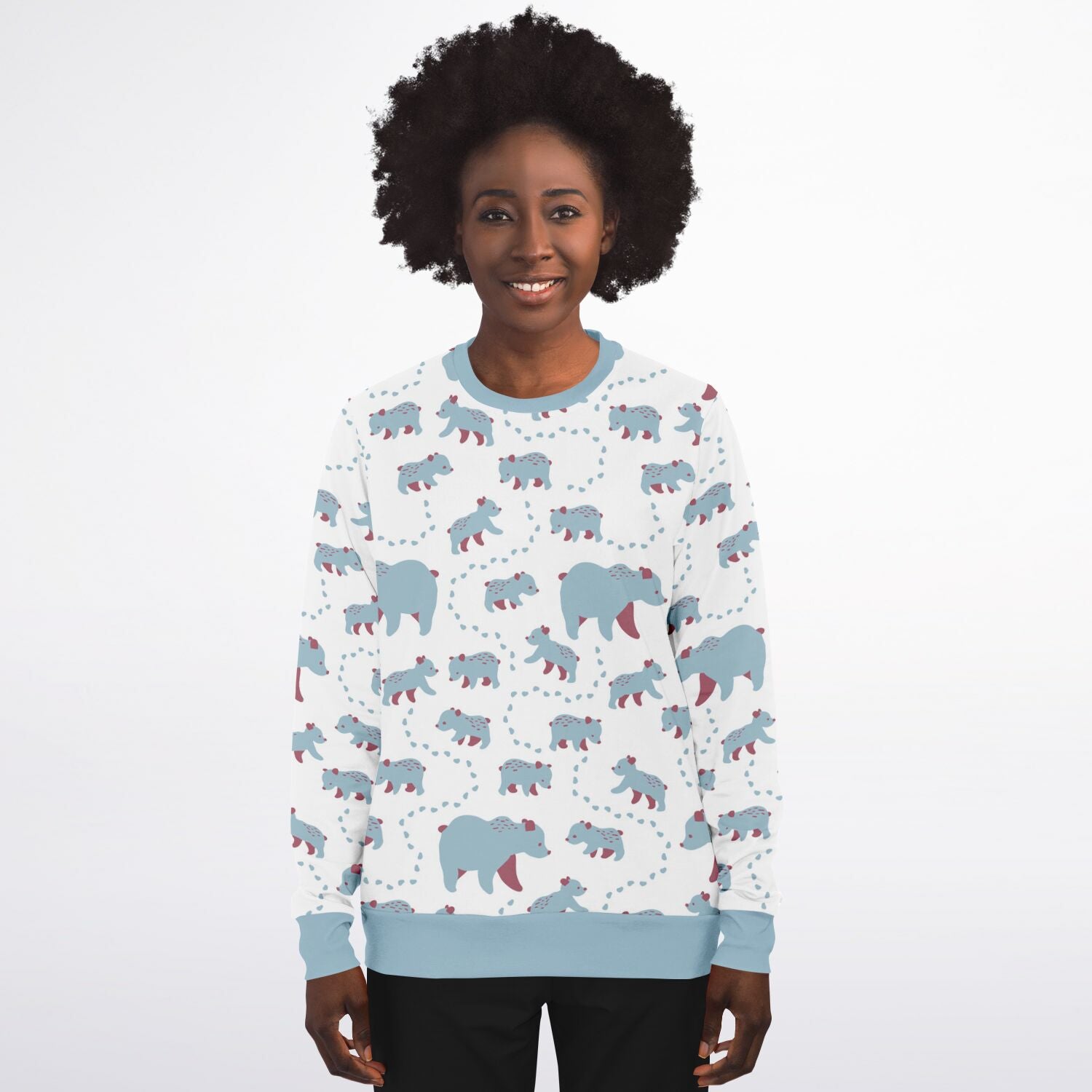 A woman wearing a unisex sweatshirt with blue Runaway Cubs -pattern.
