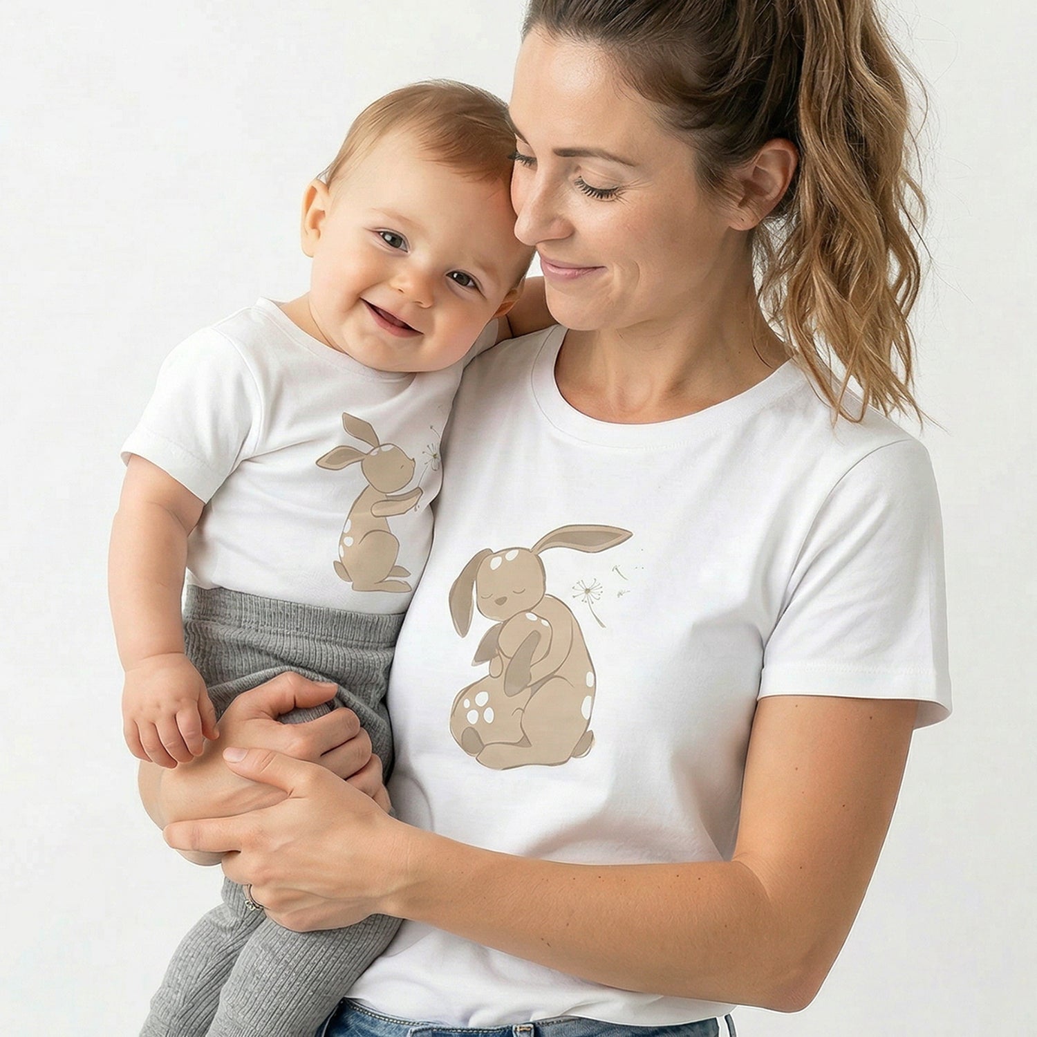 Mother and baby wearing matching Dandelion T-shirts